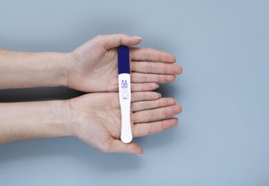 hand-holding-infertility-proof-min